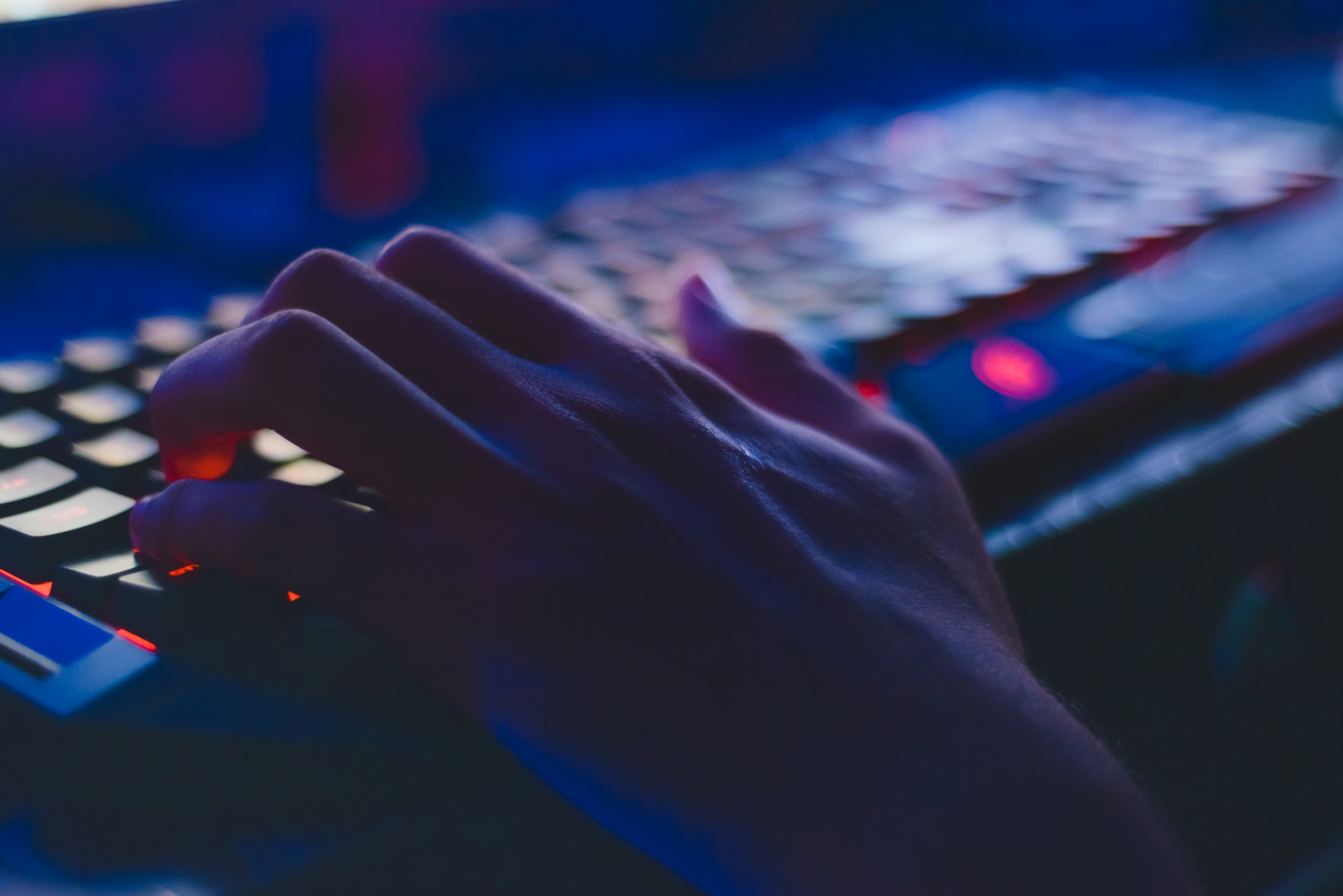 Picture of a person typing on a keyboard